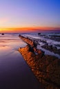 Rocks in Barrika with sunset reflection Royalty Free Stock Photo