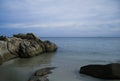 Rocks on the beach with blue sky