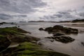 Rocks on a beach near Cape Reinga at dusk, North Island, New Zealand Royalty Free Stock Photo