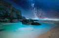 Rocks at the beach under the night sky full of stars Royalty Free Stock Photo