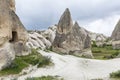 Rocks with caves and hiking trail in a valley in Cappadocia. Magnificent landscape Royalty Free Stock Photo