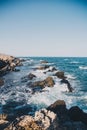 Rocks and cliffs on the beach in Playa de los Muertos, Spain