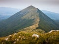 Rocks and cliffs under dark clouds trekking path at Suva Planina mountain Royalty Free Stock Photo