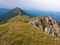 Rocks and cliffs under dark clouds trekking path at Suva Planina mountain