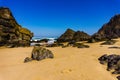 Rocks on coastline of Atlantic ocean on sandy Adraga beach, Portugal coast Royalty Free Stock Photo