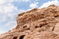 Rocks dotted with caves carved by Nabatean craftsmen in Nabatean Kingdom of Petra in Wadi Musa city in Jordan Royalty Free Stock Photo