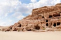 Rocks dotted with the many caves carved by Nabatean craftsmen in Nabatean Kingdom of Petra in the Wadi Musa city in Jordan Royalty Free Stock Photo