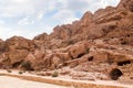 Rocks dotted with the many caves carved by Nabatean craftsmen in Nabatean Kingdom of Petra in the Wadi Musa city in Jordan Royalty Free Stock Photo