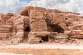 Rocks dotted with many caves carved by Nabatean craftsmen in Nabatean Kingdom of Petra in Wadi Musa city in Jordan Royalty Free Stock Photo