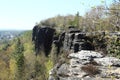 Rocks in forest with village under wall Royalty Free Stock Photo