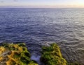 Rocks in front of Malecon and Atlantic Ocean during sunset - Havana, Cuba