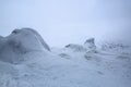 Rocks frozen with interesting textured frost and snow as if it is a giant in fairytale world. Beautiful landscape.