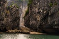 Rocks and a tiny sand beach in Ha Long Bay