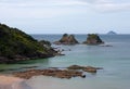 Rocks and islands near a beach in New Zealand Royalty Free Stock Photo