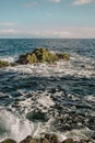 Rocks jut out from the water in Horswell channel near the shoreline of the spit at Neck Point Park, Nanaimo, British Royalty Free Stock Photo