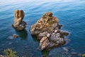 Rocks in the sea at Spiaggia Caldura beach in Cefalu, Sicily Royalty Free Stock Photo