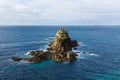 Rocks and lighthouse Lands End Cornwall England UK Royalty Free Stock Photo