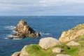 Rocks and longships lighthouse Lands End Cornwall England UK Royalty Free Stock Photo