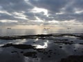 Rocks lunar landscape sea with giants cumulonimbus clouds in the sky and cargo ships at the horizon . Tuscany, Italy Royalty Free Stock Photo