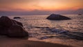 Rocks on Melina Beach at sunset, Tiomen Island, Malaysia Royalty Free Stock Photo