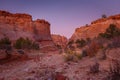 Rocks and Mountains along a trail to Tunnel Slot during sunny day with blue sky in Escalante National Monument, USA