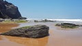 Rocks and ocean at Praia Vale Figueiras in Portugal