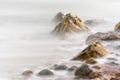 Rocks at Osmington Reflecting Sunset Colours