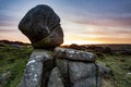 Rocks at Owler Tor under a cloudy sky during the sunset in the Peak District in the UK Royalty Free Stock Photo