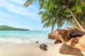 Rocks and palm trees by the sea in world famous Anse Lazio Royalty Free Stock Photo