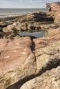 Rocks, pools and cliff at Hilbre Island, Wirral, England