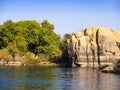 Rocks on the River Nile at Aswan in Egypt that mark limit of cruises Royalty Free Stock Photo