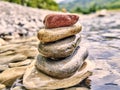 Rocks, river pebbles stacked in a stream