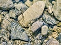 Rocks, river pebbles in a streaming water