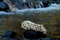 Rocks and river stones, river water background Royalty Free Stock Photo