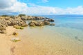 Rocks and sand in Alghero coastline