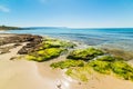 Rocks and sand in Le Bombarde beach in Alghero Royalty Free Stock Photo