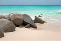 Rocks on a sandy beach on Aruba in the Caribbean Sea Royalty Free Stock Photo