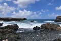 Rocks Scattered Across Aruba`s Black Sand Stone Beach Royalty Free Stock Photo