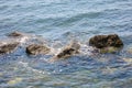 Rocks in the sea on a background. Rocky coast in the sea, close-up of the stones Royalty Free Stock Photo