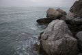 Rocks and sea shot on cloudy day Royalty Free Stock Photo