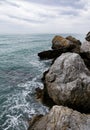 Rocks and sea shot on cloudy day Royalty Free Stock Photo