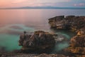 Rocks in the sea at sunset