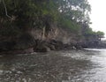 Rocks in the sea. The waves hitting the rocks