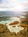 Rocks, sea waves and sunny sky Royalty Free Stock Photo
