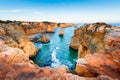 Rocks on the shore of Atlantic ocean in Algarve, Portugal. Summer seascape at sunset Royalty Free Stock Photo