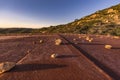 Rocks splayed upon a rusty water tower Royalty Free Stock Photo