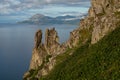 Rocks on a steep slope above the sea.