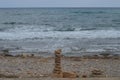 Rocks or stone balancing tower with pebble/rocks beach and sea background Royalty Free Stock Photo