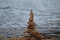 Rocks or stone balancing tower with sea as background Royalty Free Stock Photo