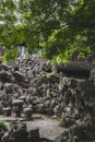Rocks and stone seatings in Chinese garden on Huxin Island in South Lake in Jiaxing, China